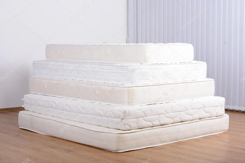 Many mattresses Stock Photo by 57171139