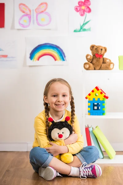 Girl with toy bee — Stock Photo, Image