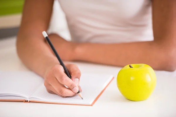 Mulatto girl holding pencil — Stock Photo, Image