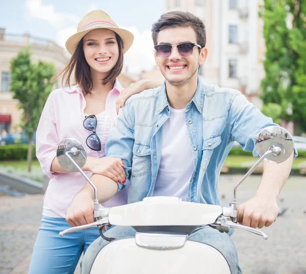 Young couple on scooter — Stock Photo, Image