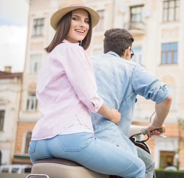 Young couple on scooter — Stock Photo, Image