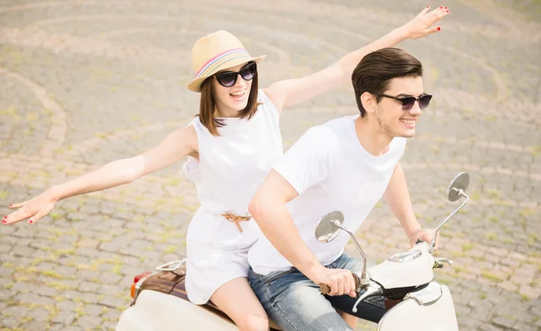 Young couple on scooter — Stock Photo, Image