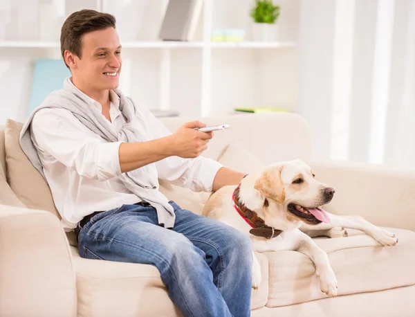 Young man with dog — Stock Photo, Image