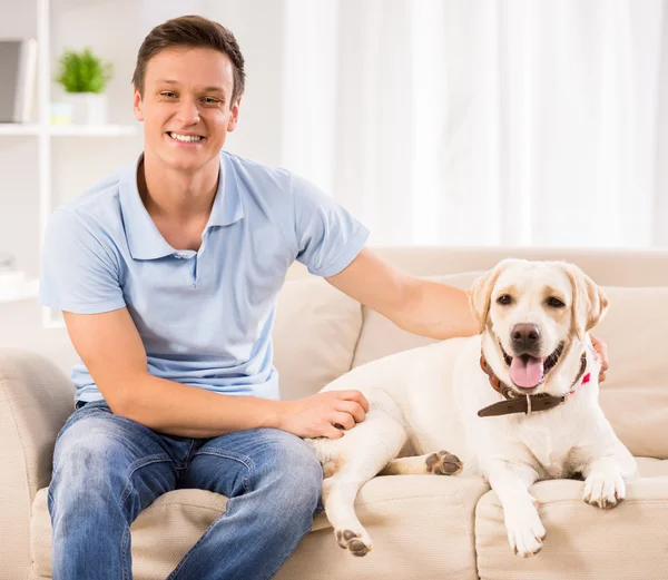 Young man with dog — Stock Photo, Image