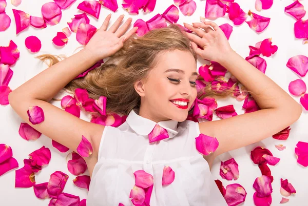 Woman with petals — Stock Photo, Image