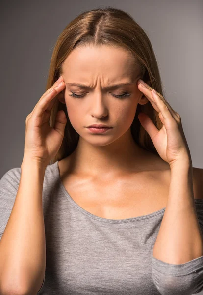 Young woman with headache — Stock Image Young woman with headache Stock Photo