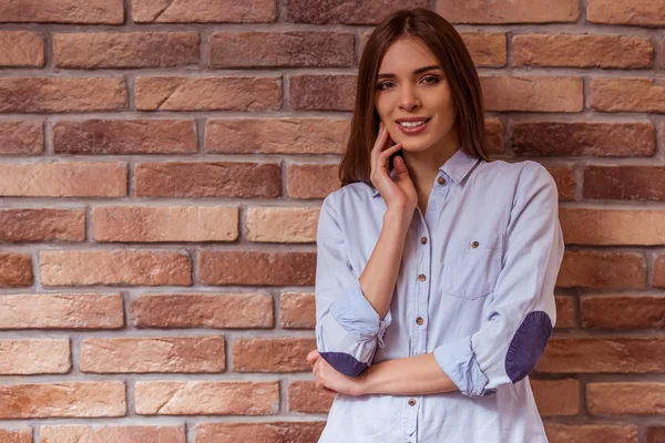 Beautiful girl posing with gadget — Stock Photo, Image