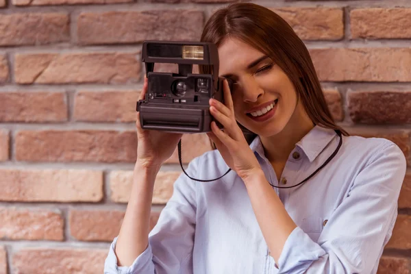 Beautiful girl posing with camera — Stock Fotó