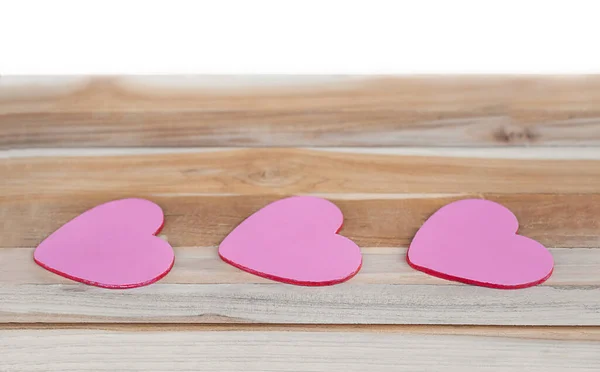 Drei Herzen Auf Einer Hölzernen Fläche Isoliert Pinkfarbene Herzen Einer — Stockfoto