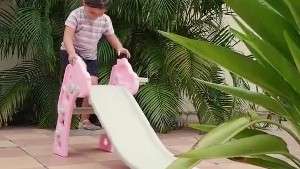 Child Rolling Slide Outdoors — Stock Video