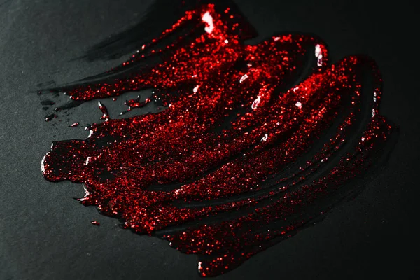 Gel Transparente Con Purpurina Roja Untada Sobre Papel Negro —  Fotos de Stock