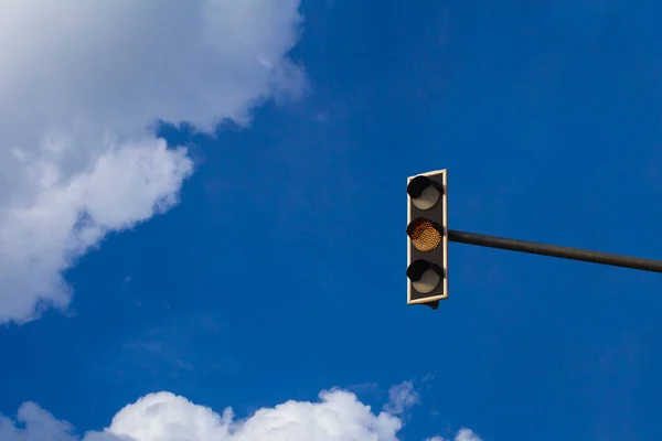 Traffic light with yellow light on