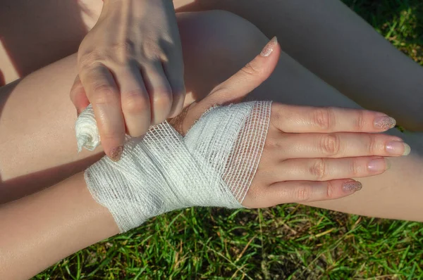Girl Bandages Her Injured Palm Wrist Outdoors Summer Sunny Day — Stock Photo, Image
