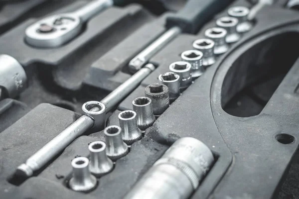 Mechanics toolbox, set of tools: wrench, screwdriver, set of wrench, and bits, ratchet. Selective focus — Stock Photo, Image