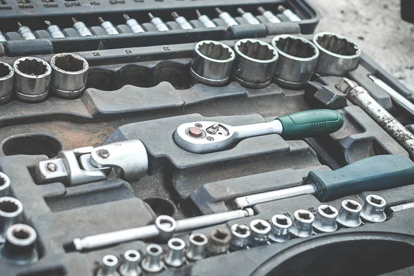Selective soft focus. Mechanic tool. Tool box, tool set. Dirty set of screwdriver, wrench and bit sets, ratchet.