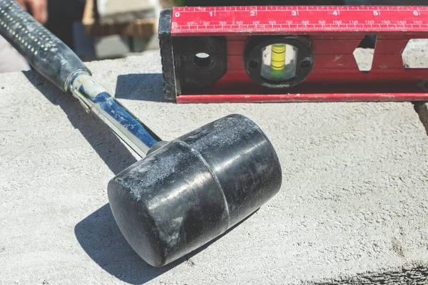 Bricklayer Rubber Hammer Spirit Level Lie Construction Site Outdoors — Stock Photo, Image