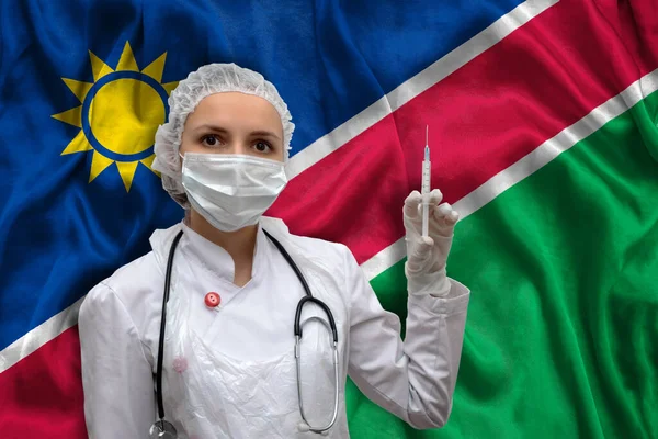 Jovem Médica Uniforme Médico Fundo Bandeira Nacional Namíbia Está Segurando — Fotografia de Stock