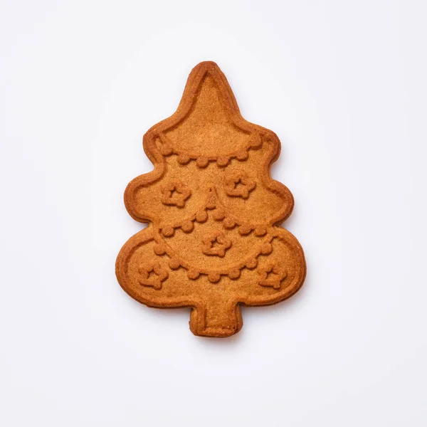 新年のジンジャーブレッドまたはクリスマスツリーの形をしたクッキーは 白い背景に隔離されています 正方形の画像 トップ表示 — ストック写真