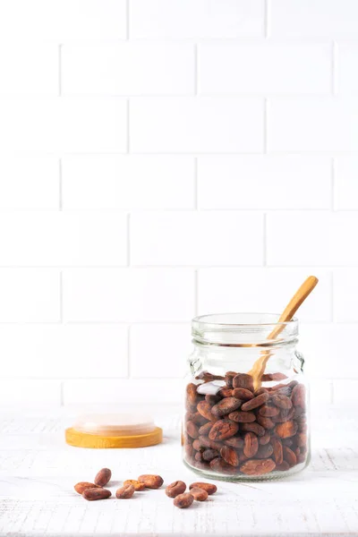 Cocoa Beans Glass Jar Light Kitchen Table Culinary Food Cooking — Stock Photo, Image