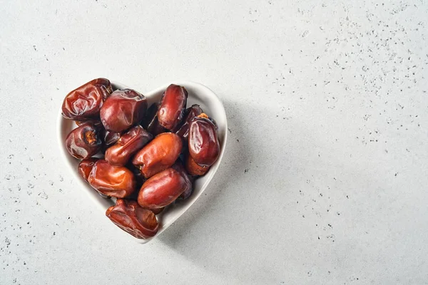 Dried Sliced Date Fruit Heart Shaped Ceramic Plate White Background — Stock Photo, Image