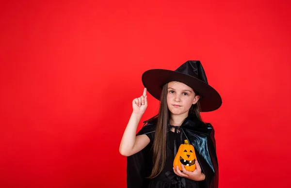 Young Brunette Girl Witch Costume Hat Holds Pumpkin Shows Her — 스톡 사진