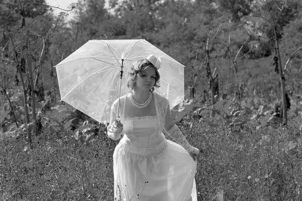 Girl in the white dress and umbrella — Stock Photo, Image