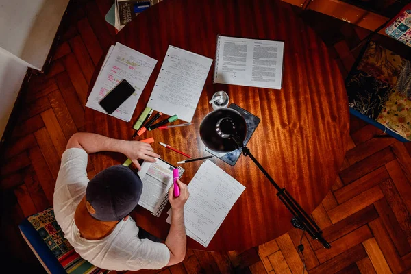 Overhead Shot of a student working at home