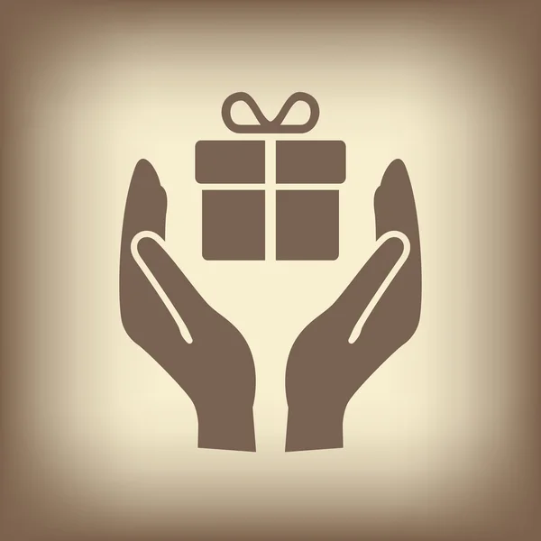 Cadeau dans les mains icône . — Image vectorielle