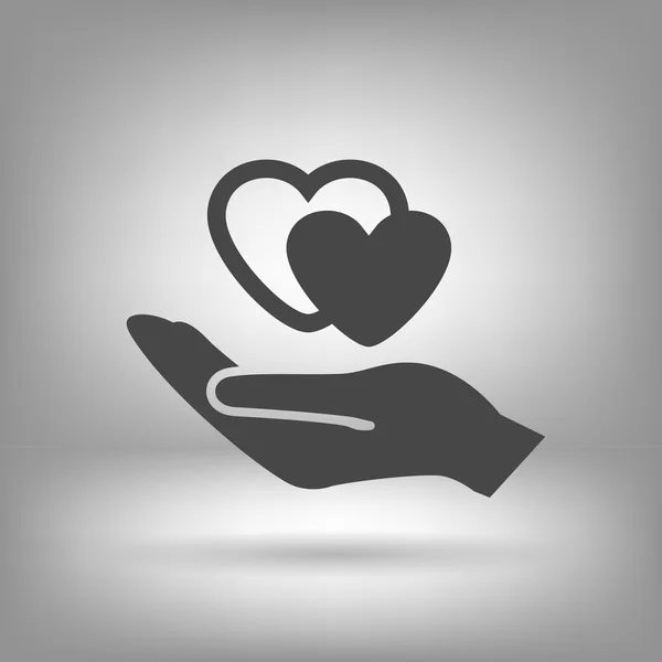 Heart in hand icon — Stock Vector