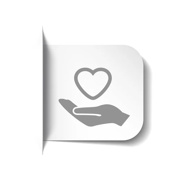 Heart in hand icon — Stock Vector