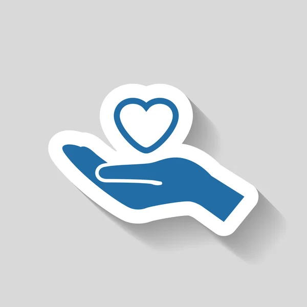 Heart in hand icon — Stock Vector