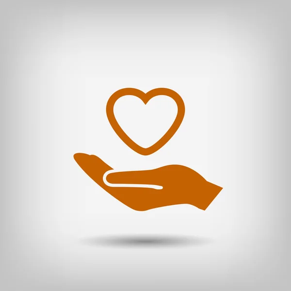 Heart in hand icon — Stock Vector