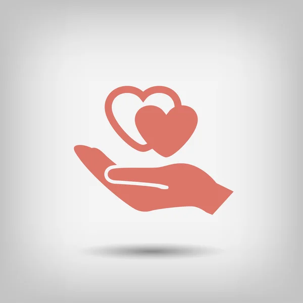 Heart in hand icon — Stock Vector