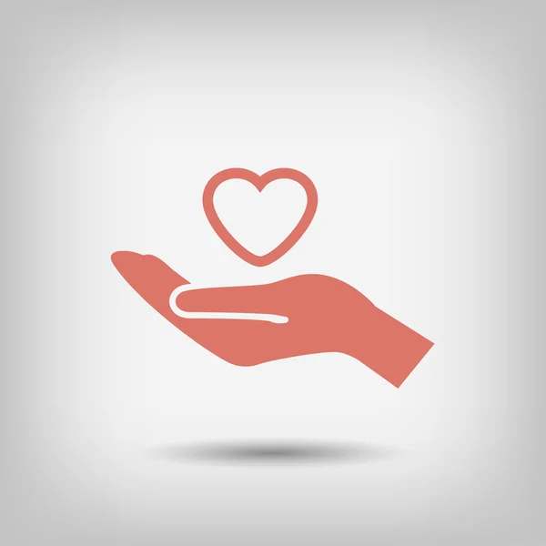 Heart in hand icon — Stock Vector