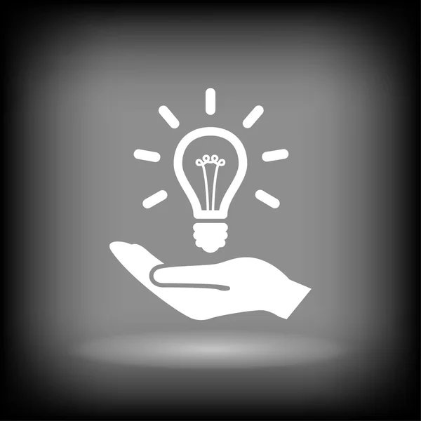 Main avec icône ampoule — Image vectorielle