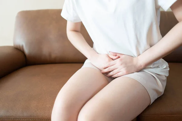 Woman hands holding her crotch suffering from pain or itchy. Gynecological problems include menstrual disorders, urinary incontinence, genital tract infections, pelvic pain or ovarian cysts.