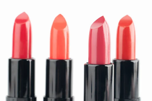 Red Lipsticks Different Shades Black Tube Package White Background Makeup — Stock Photo, Image