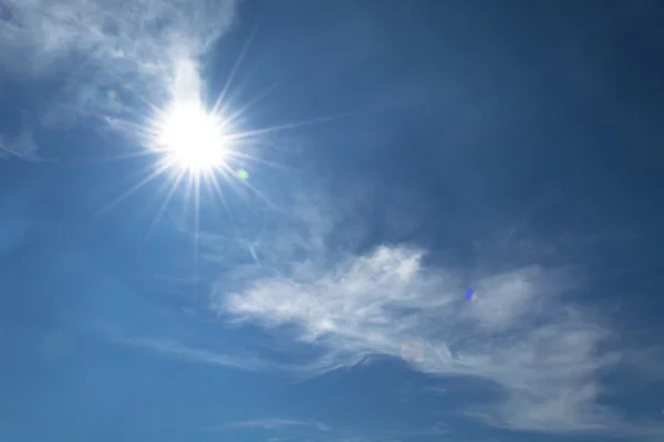 Sun flare on blue sky background — Stock Photo, Image