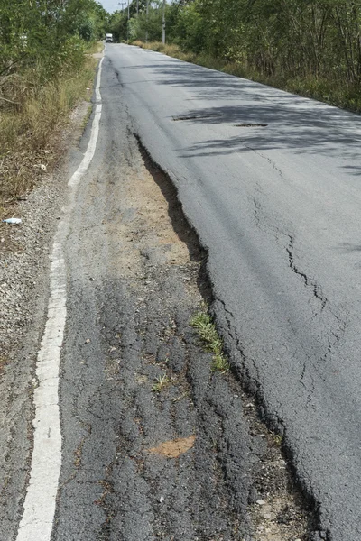 stock image Asphalt surface on the street was demolished due to poor constru