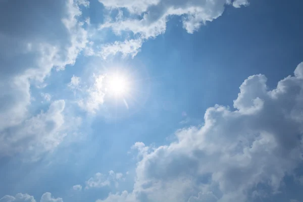 Sun flare on blue sky background — Stock Photo, Image