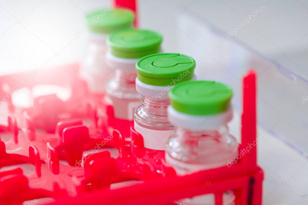 Lab bottle vaccine on a dry ice storage. 