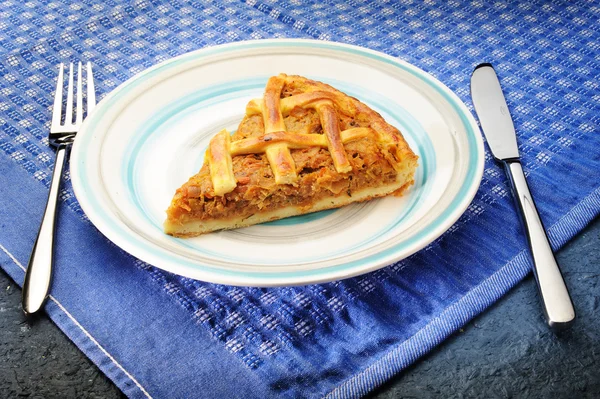 Salty piece of cake on a plate — Stock Photo, Image