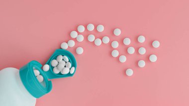 Kavanozdan çıkan melatonin tabletlerinin üst görüntüsü. Beslenme konsepti. Beslenme takviyesi yakın plan