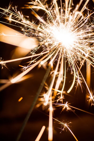 Sparkler on blurred background — Stock Photo, Image