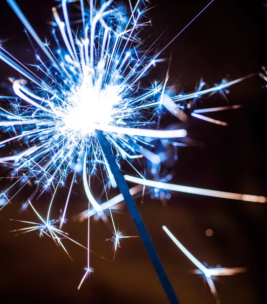 Sparkler on blurred background — Stock Photo, Image