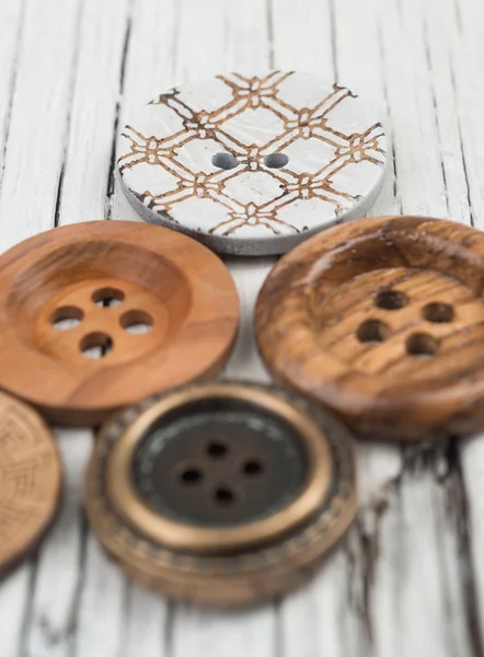 Buttons on wooden table — Stock Photo, Image