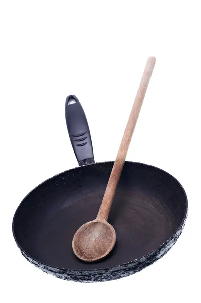 Old frying pan and spoon — Stock Photo, Image