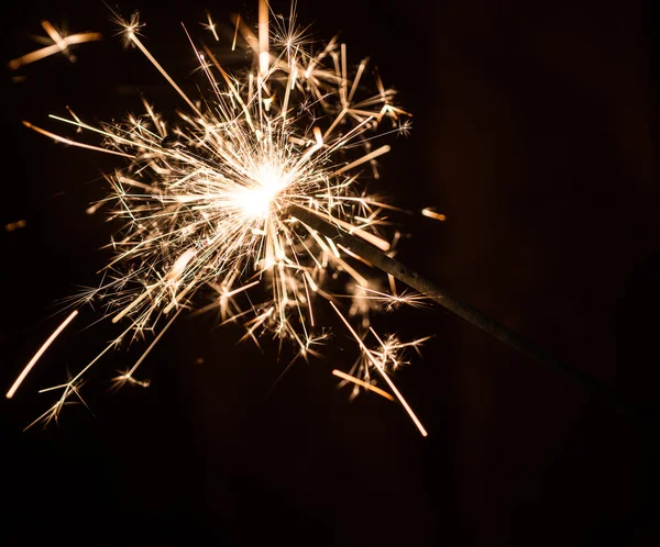 Sparkler on blurred background — Stock Photo, Image