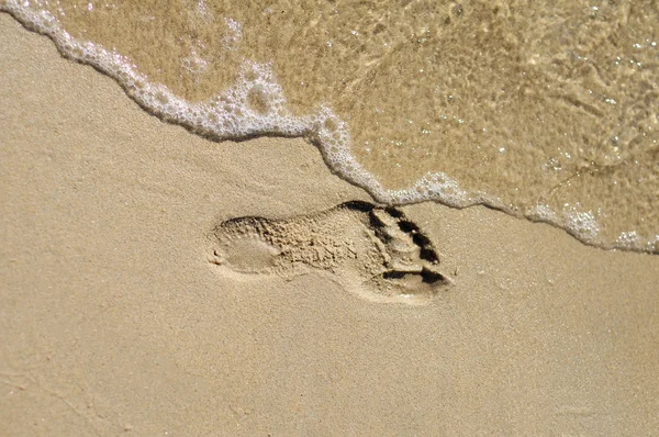 Fotavtryck på en strand — Stockfoto