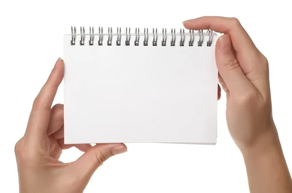 Händer som håller notebook — Stockfoto